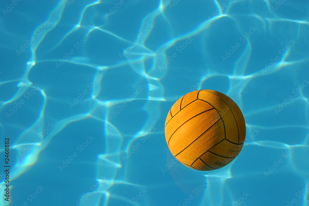 yellow waterpolo ball in blue pool