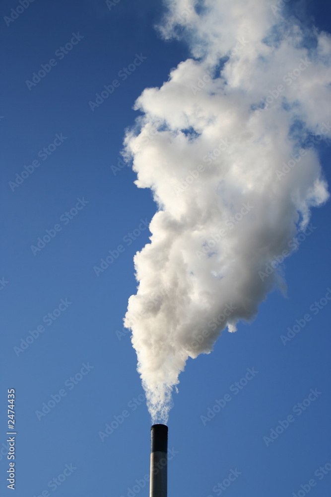 chimney billowing white smoke into blue sky chimney billowing white smoke into blue sky