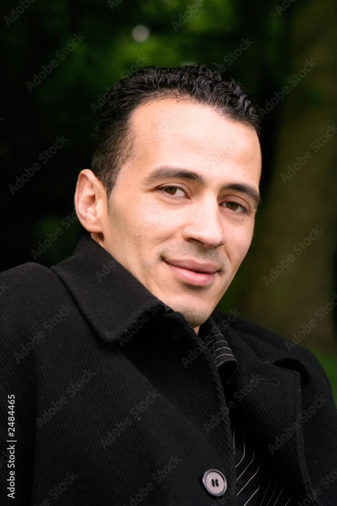 Young man in black coat