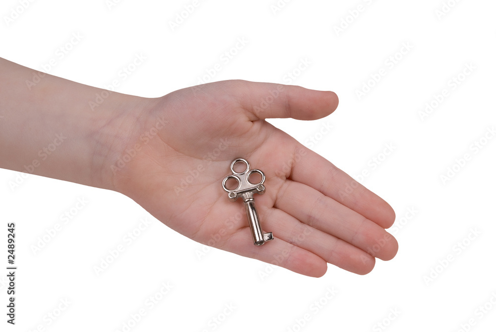 child's hand with key