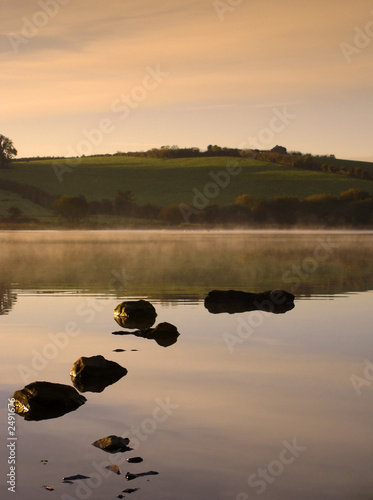dawn on a misty lake