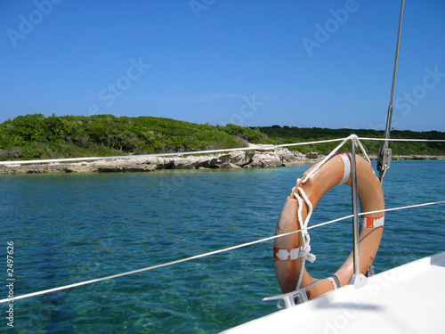 yacht and life buoy scene photo