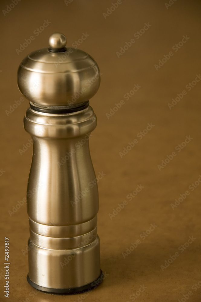 pepper mill sitting on a bworn kitchen counter pepper mill sitting on a bworn kitchen counter