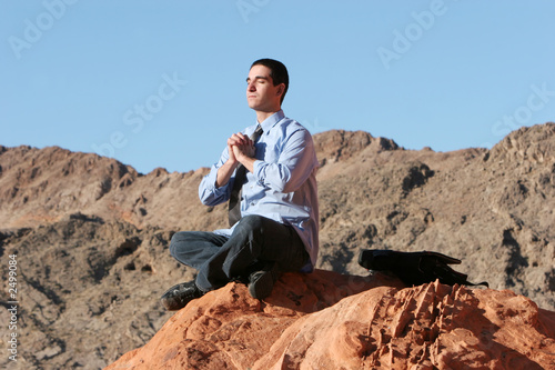 young business man meditating © MaxFX