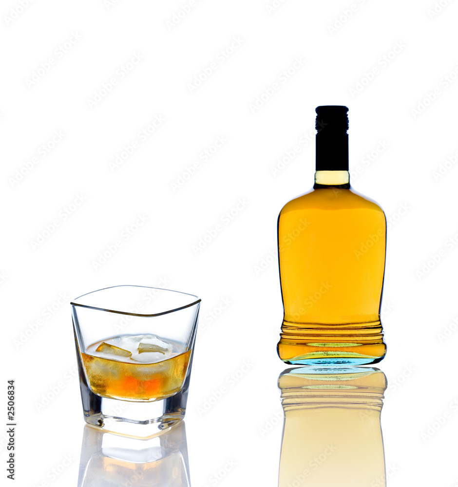 whiskey bottle and a whiskey glass whiskey bottle and a whiskey glass