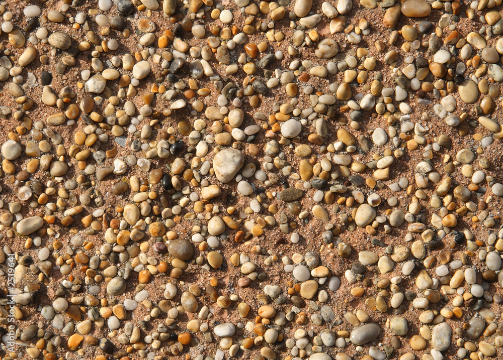 close up of stones stuck to a wall. close up of stones stuck to a wall.