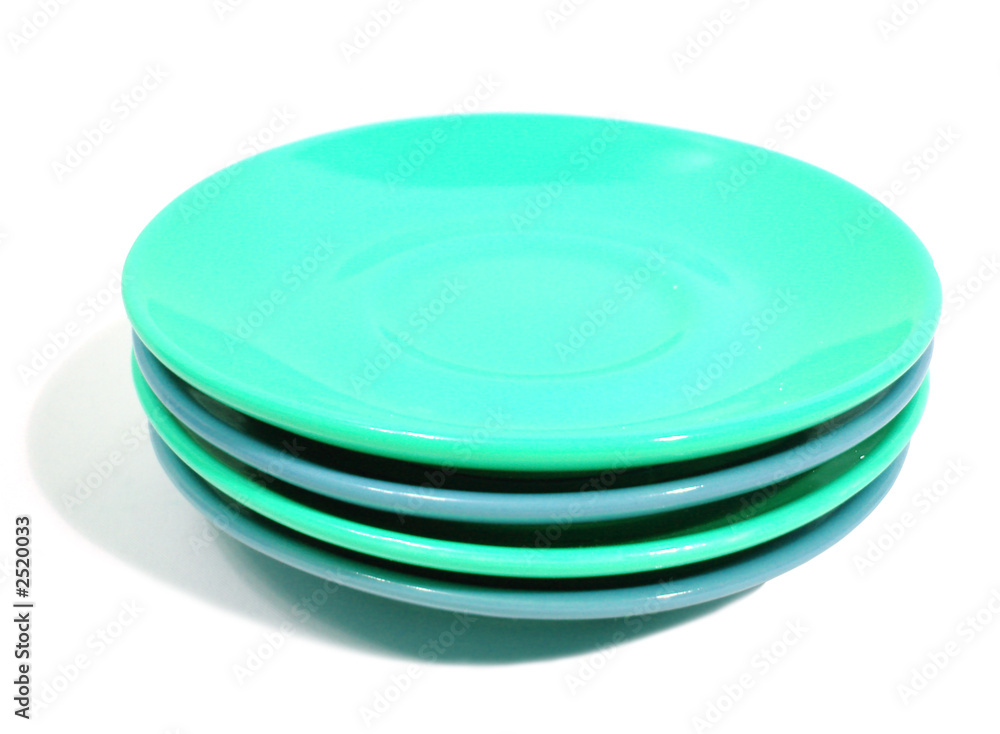 stack of green and blue plates on white background stack of green and blue plates on white background