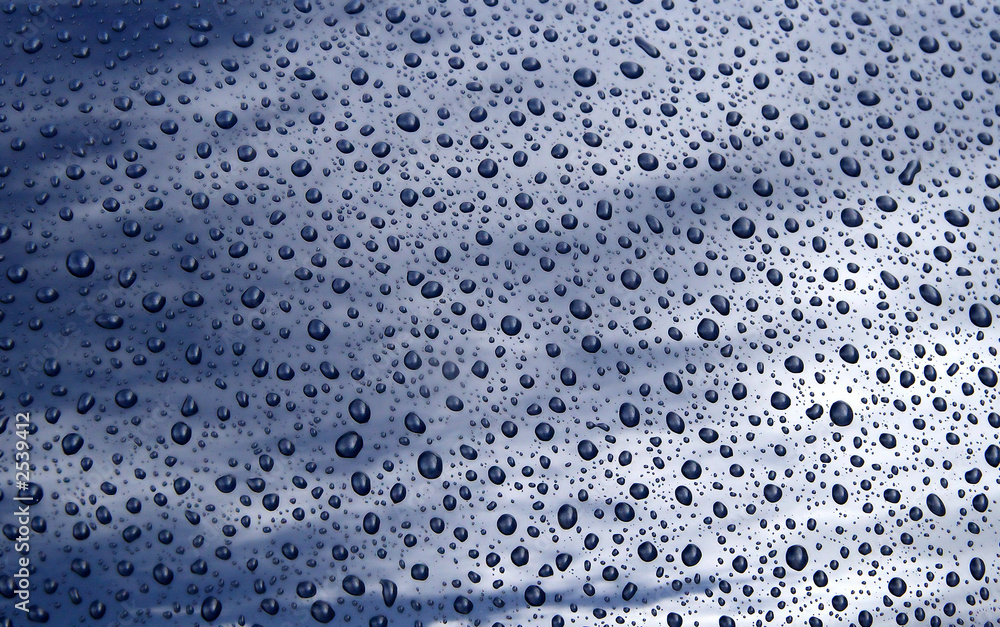 close up of raindrops on a car bonnet. close up of raindrops on a car bonnet.