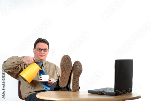 young businessman having coffee break photo