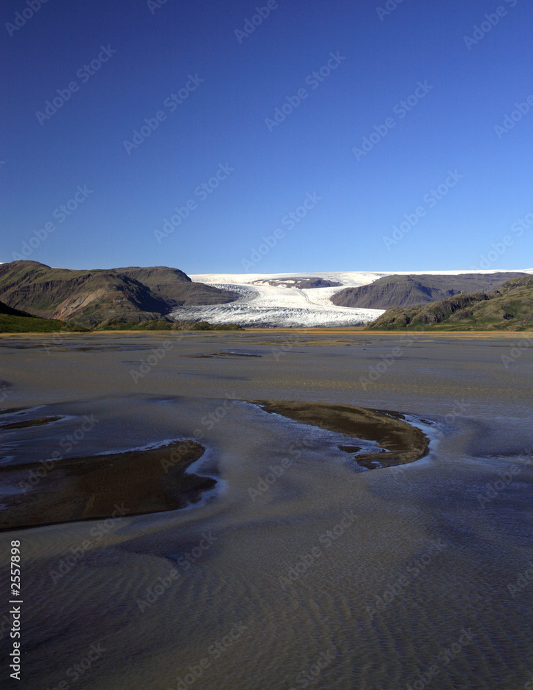 view over the water to the glacier