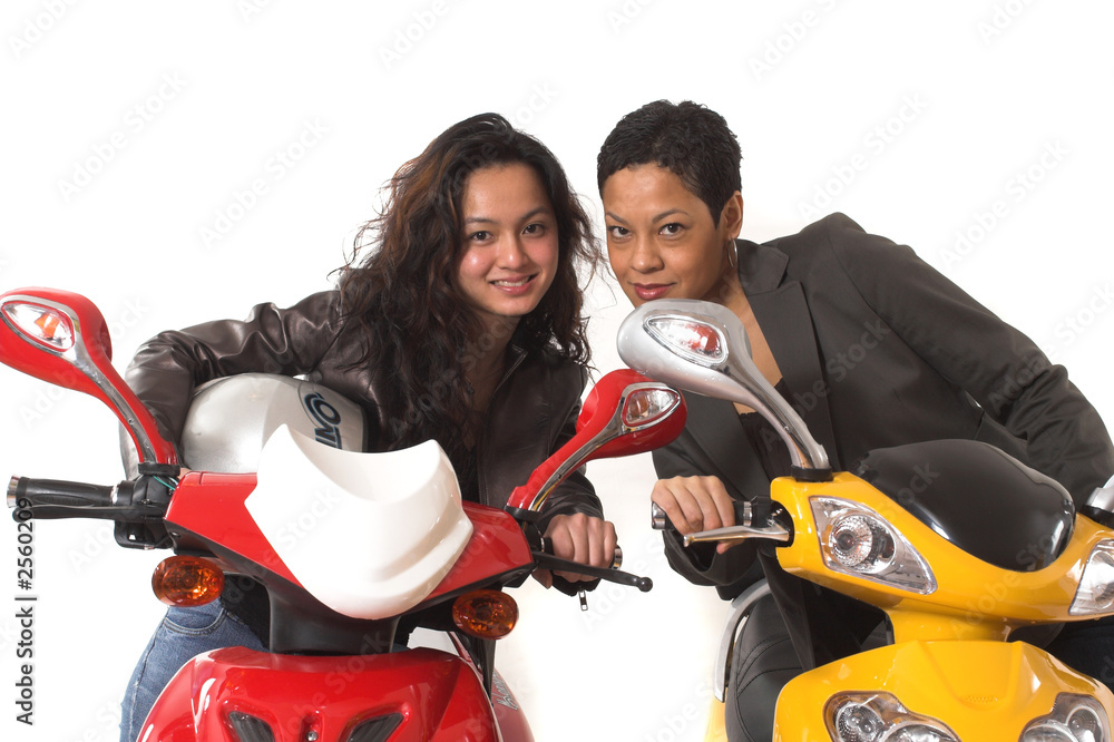 Obraz premium girls having fun on electric scooter