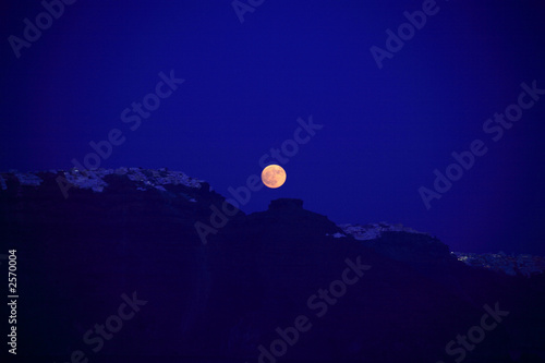 orange moon over santorini photo