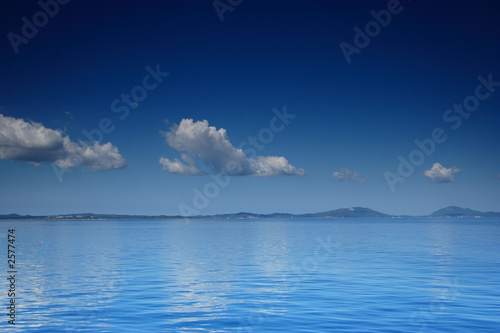 view of an open sea with a cloud on corfu island