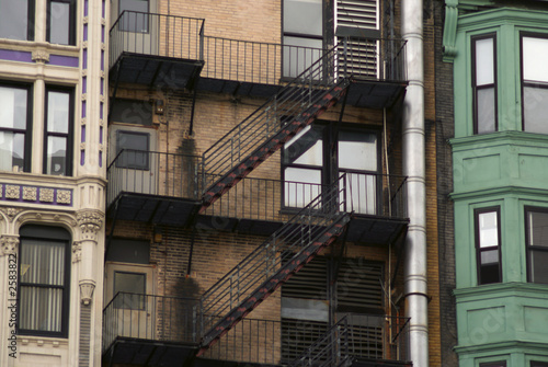three buildings and a fire escape