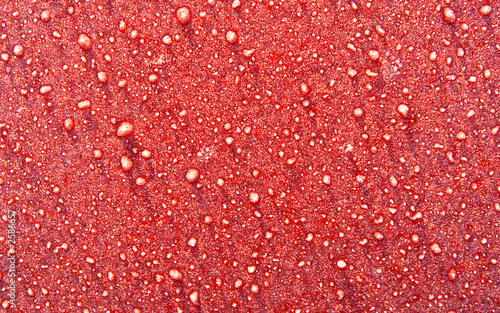 abstract morning frost on a red metal surface back