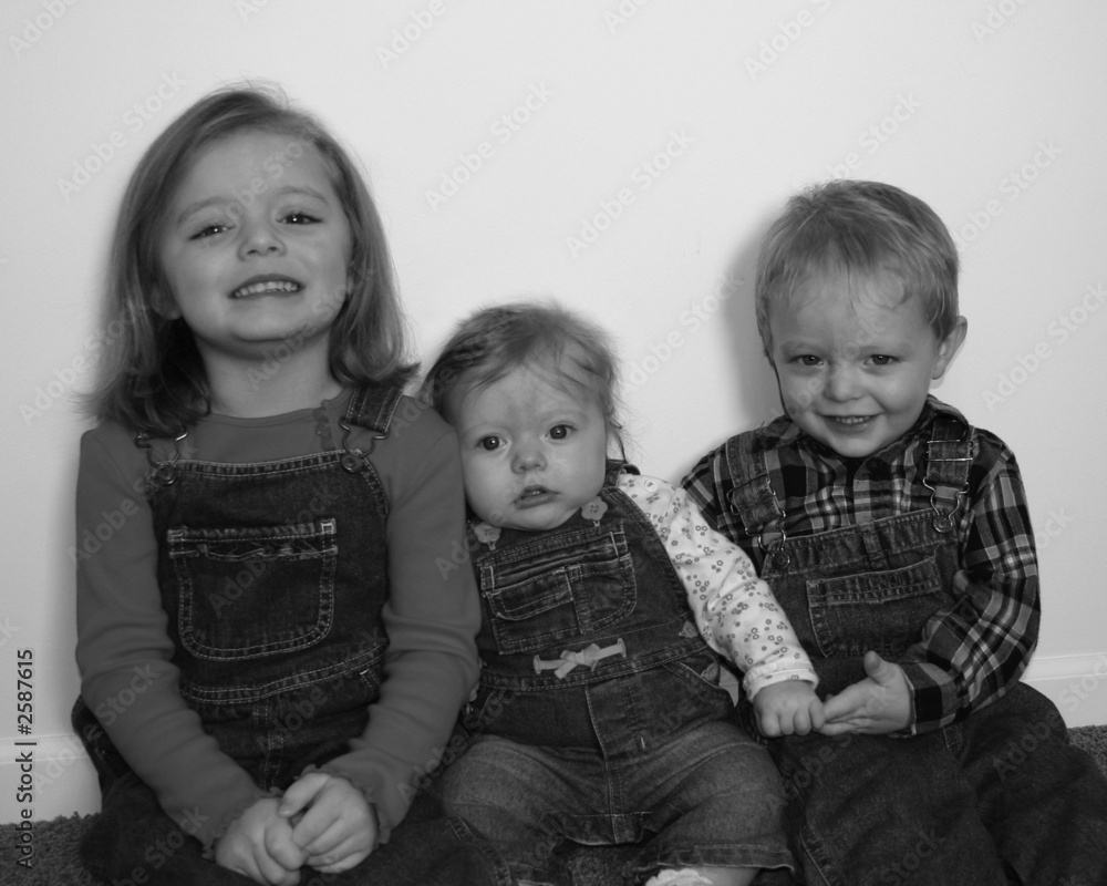 three cute kids standing together