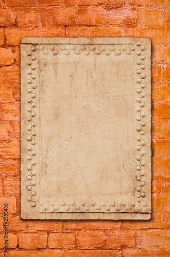 metal plate on brick wall - perfect grunge background
