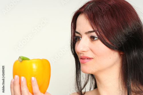 woman and yellow peper