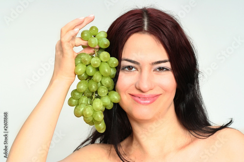 woman take green grapes