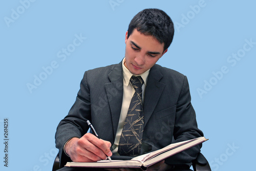 young businessman writing