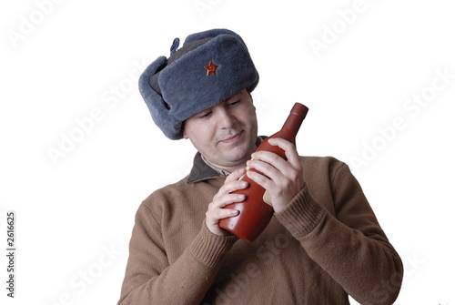 man portrait with a russian hat and a red bottle