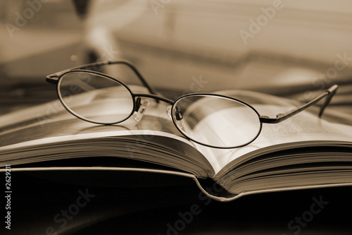 close up on the glasses and the magazine