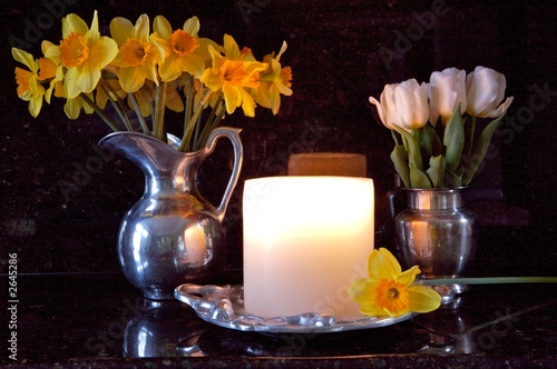 daffodills and  white tulips in candlelight photo