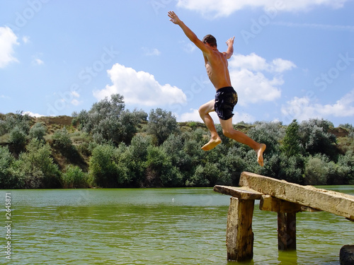 boy jumping in water