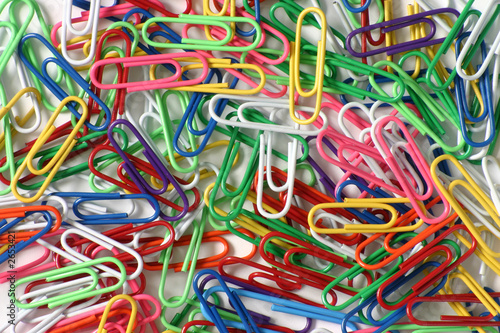 color paperclips on white background