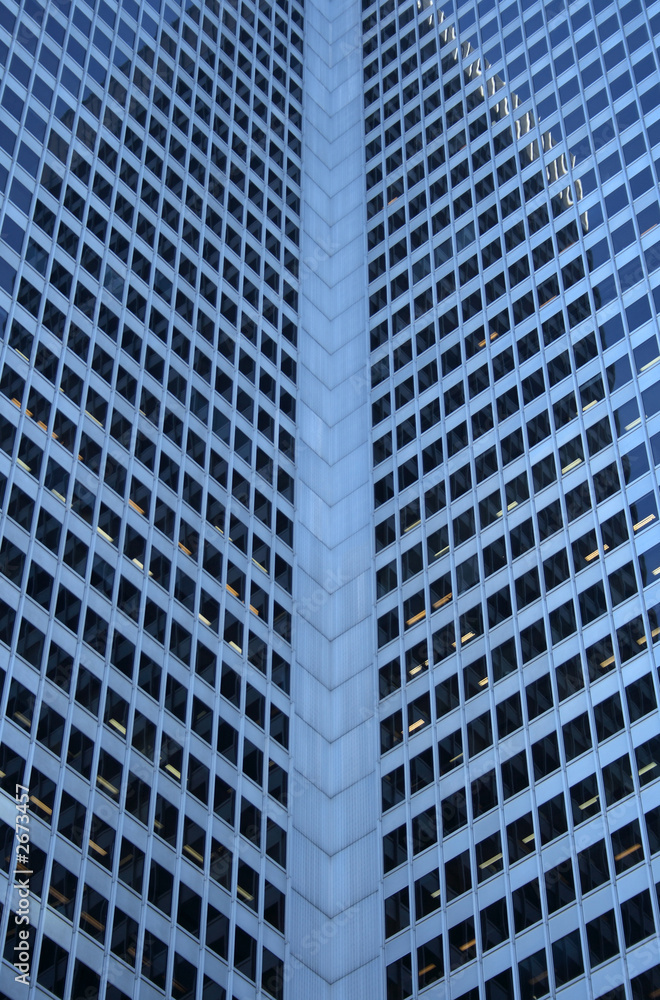 inside corner of a glass-windowed office tower inside corner of a glass-windowed office tower