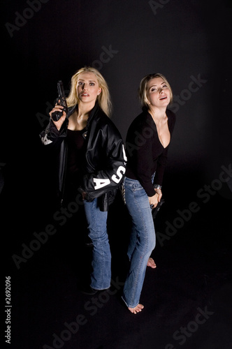 two woman with guns