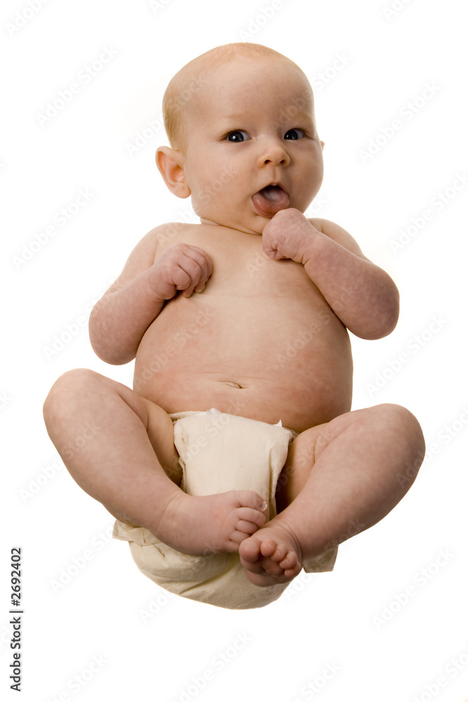 newborn in diaper with hand in mouth newborn in diaper with hand in mouth