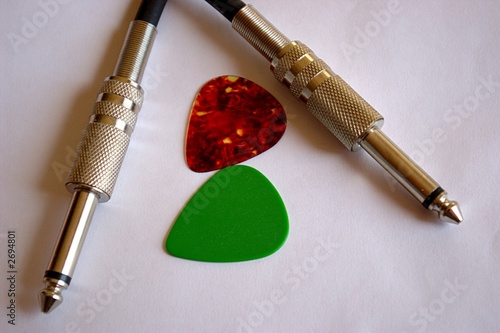guitar picks and cable jacks