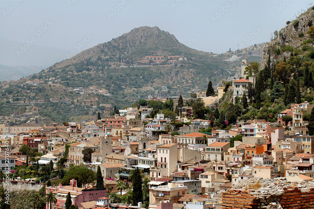 taormina, sicily with mountains in background