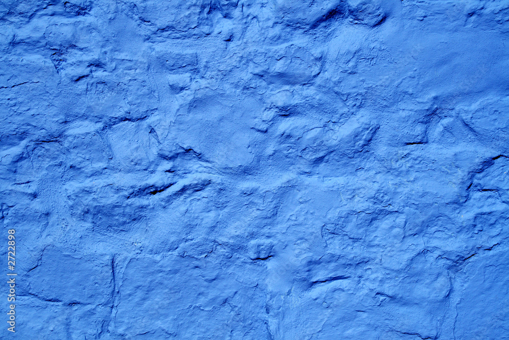 vivid blue color painted wall surface.