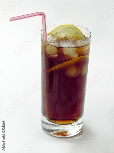 brown drink with ice and lemon-slices