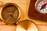 old style brass compasses