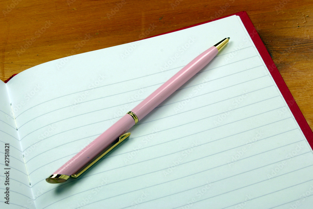 pen on a notebook pen on a notebook