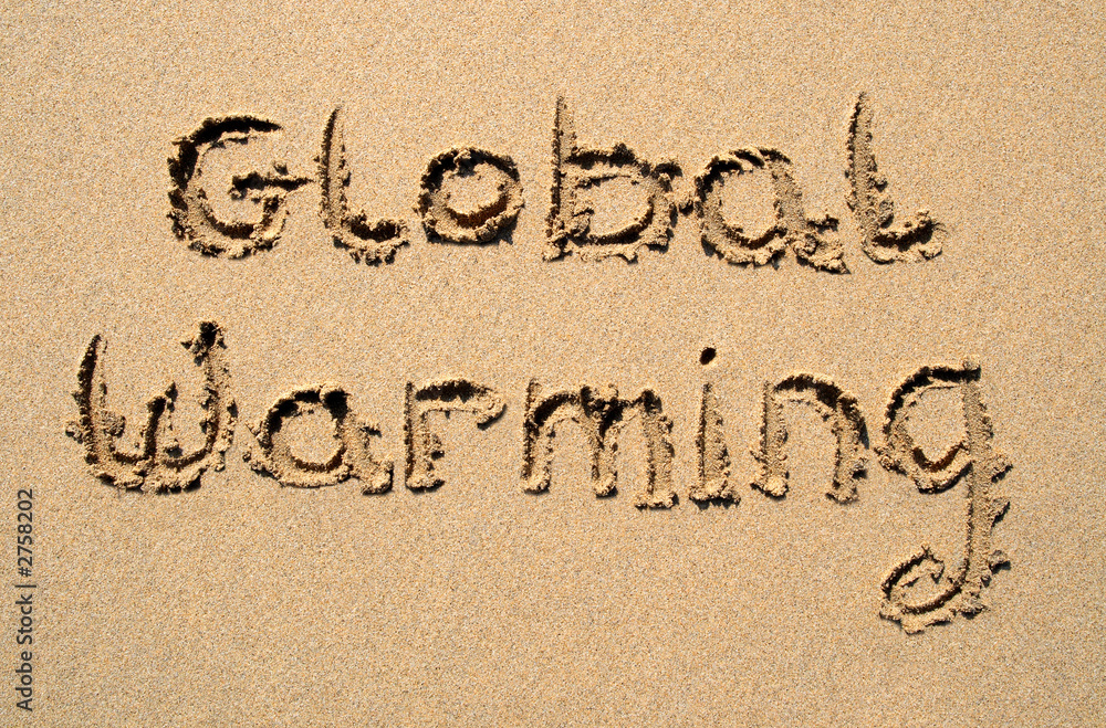 global warming, written on a beach.
