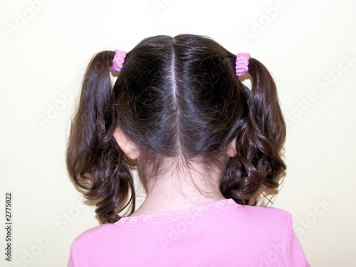 child's hair in pig tails / girl