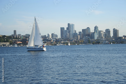sailing boat with seattle skyline