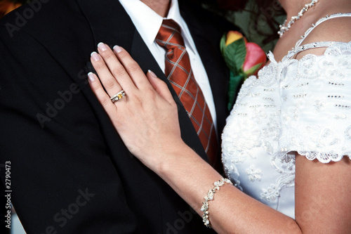brides hand on grooms lapel