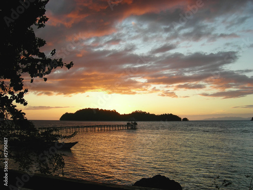 sunset over a tropical beach, togians island, sulawesi, indonesi