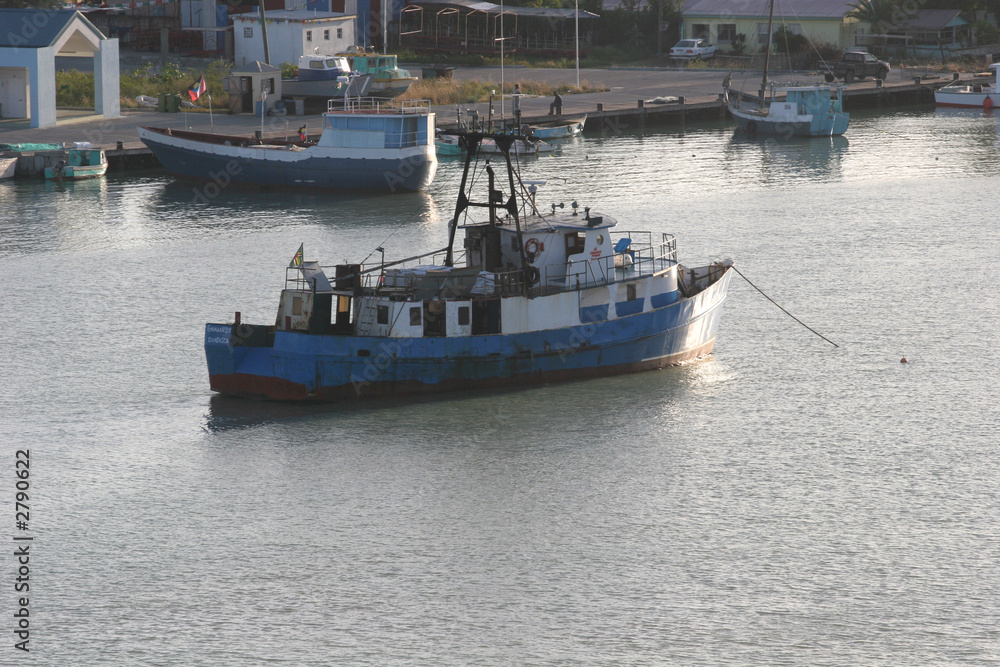 blue boat at anchor