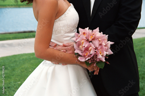 close up of bridal couple and bouquet