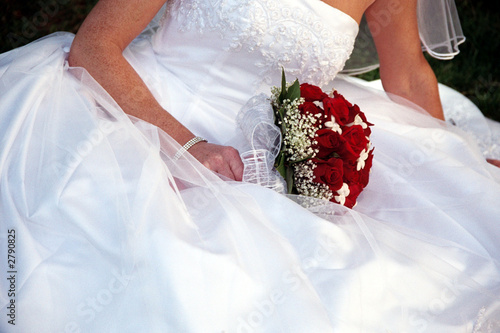 bride with red rose bouquet