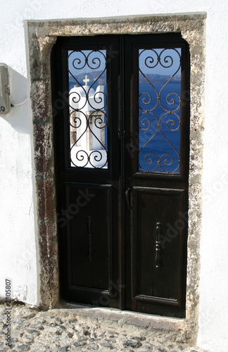 greek island door with stucco building santorini