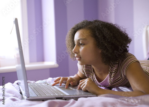biracial girl on laptop