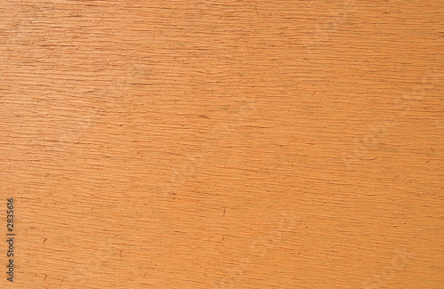 close up detail of wood painted orange.