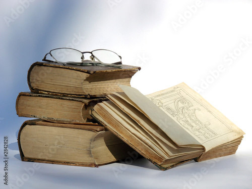 old books and glasses